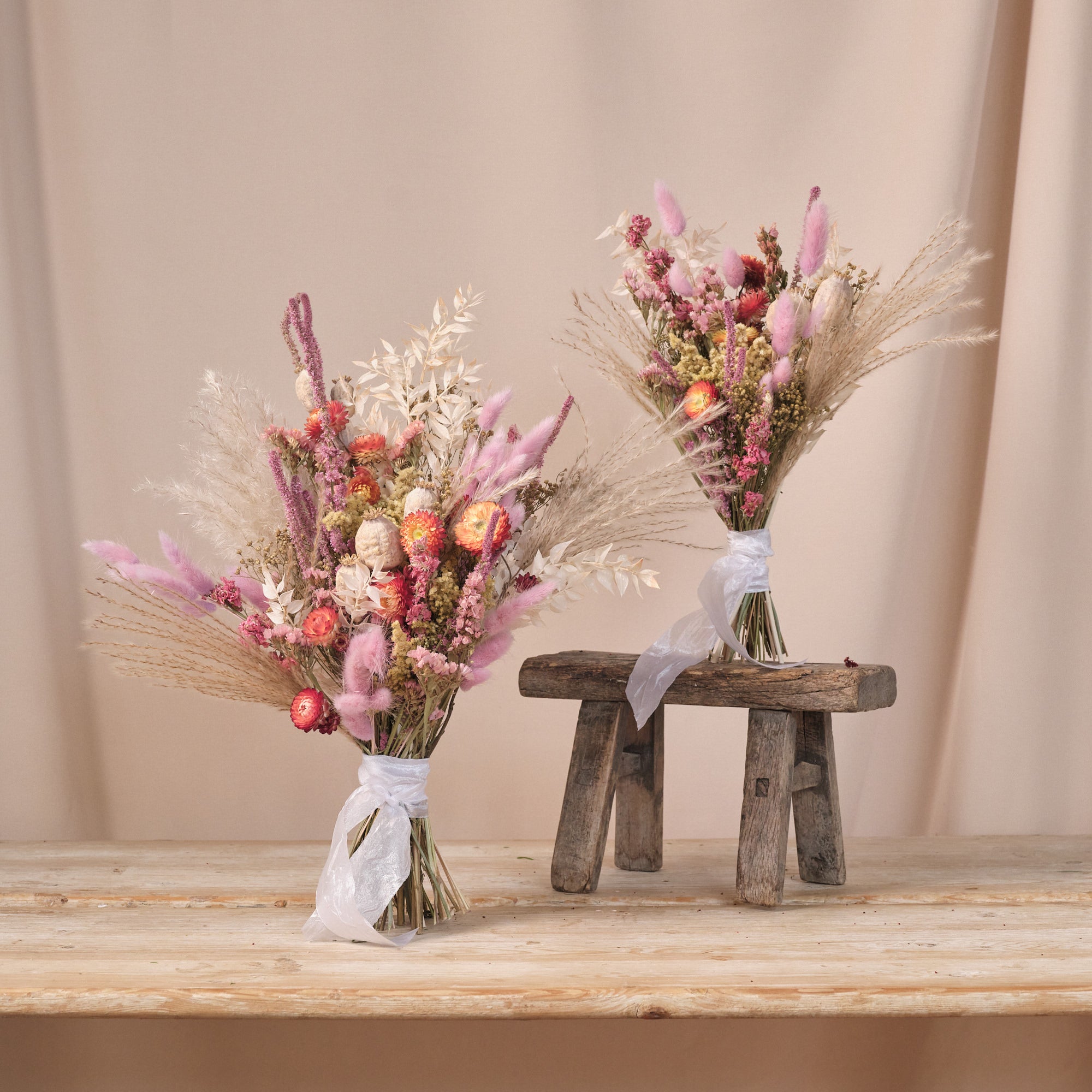 Dried flower wedding or bridal bouquets standing up on a table, created by botanique workshop, wedding florist in london